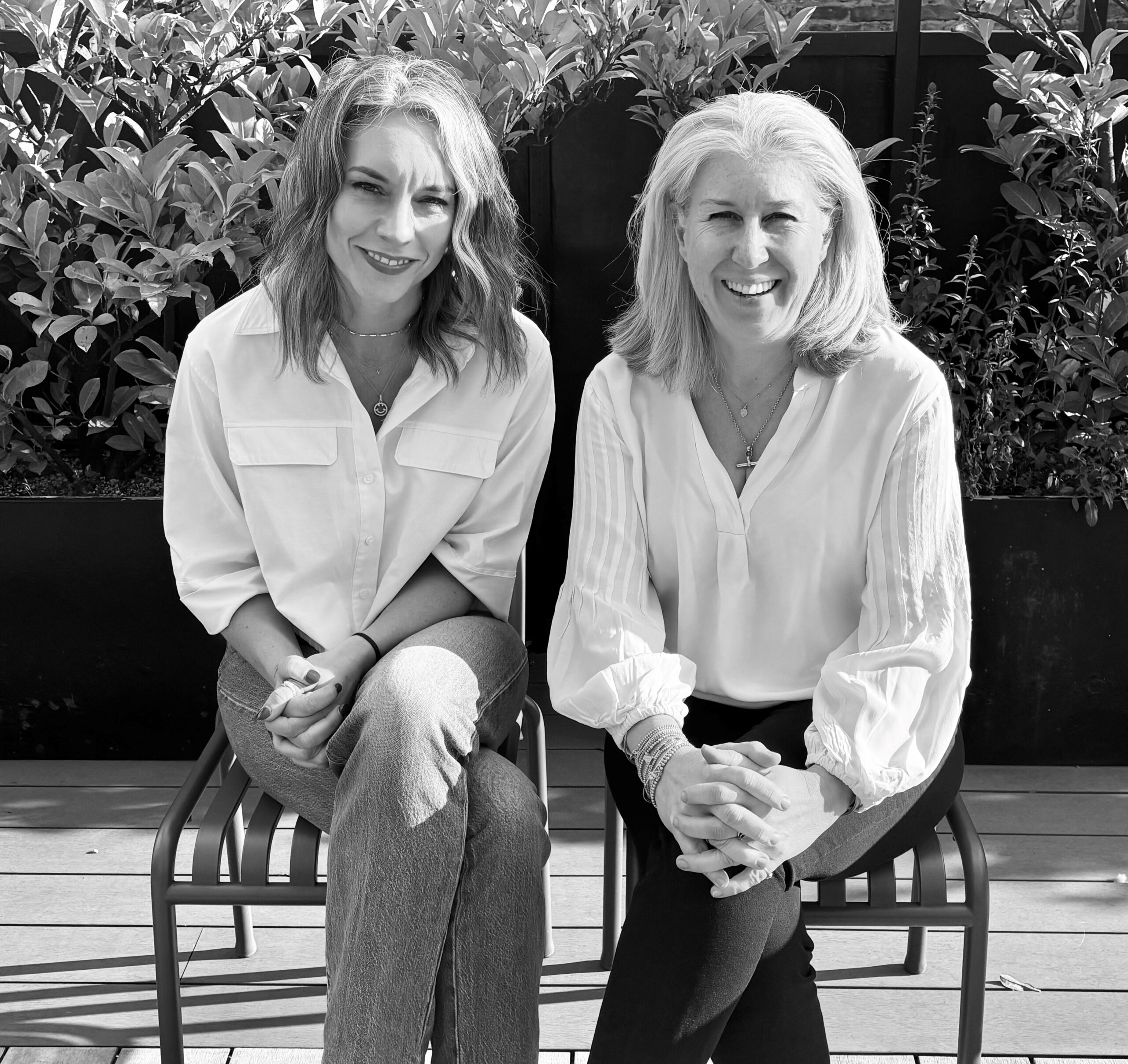 A black and white photograph of newly promoted Managing Dirctor, Natalie Napier next to Global Managing Director, Sarah Skinner.